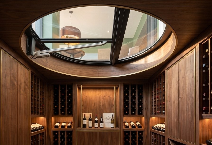 Concept visualisation of the finished wine cellar with walnut racking and the circular glass door above